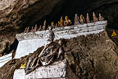 Luang Prabang, Laos - The Pak Ou Caves, the lower cave called Tham Ting. The caves, a Buddhist pilgrimage site, are a repository of old Buddha statues.